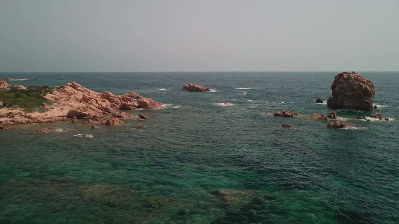 Idyllic Seascape With Rocky Coast During Summer In Sardinia Italy aerial drone shot