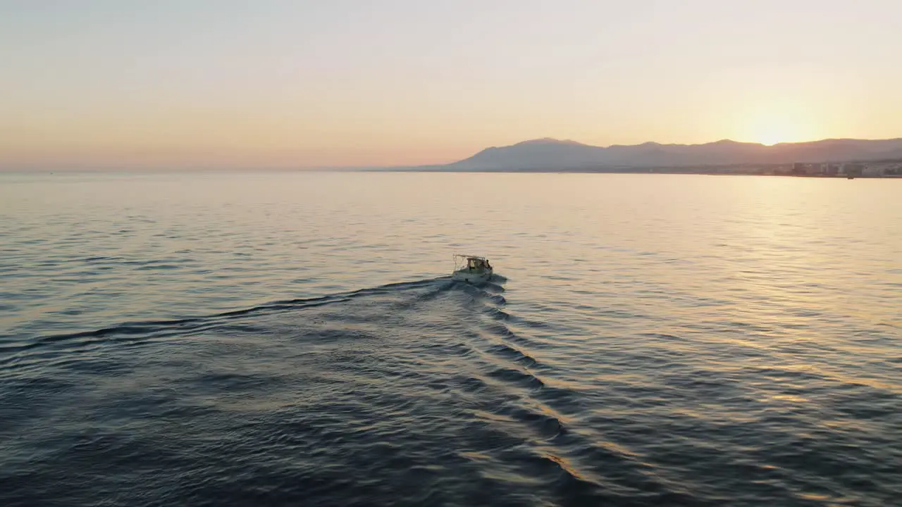 Aerial vew of boat alone in the Mediterranean sea near the coastline of Marbella Spain