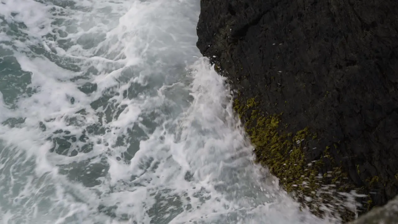 Mossy Rocks With Crashing Waves In Newquay Harbour Cornwall England