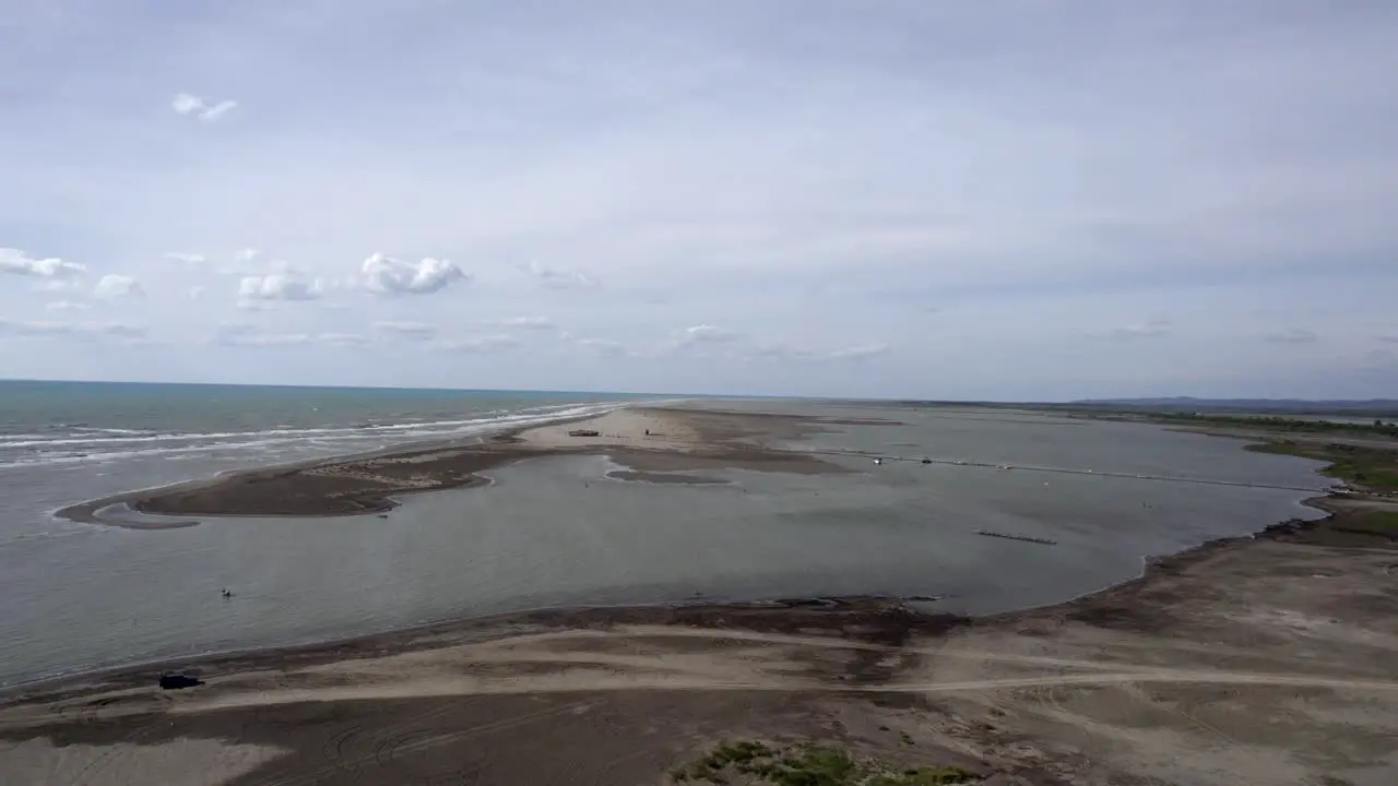 Drone video over the Divjake-Karavasta nature park Front shot advancing between the beach and the nature park leaving the sea to one side