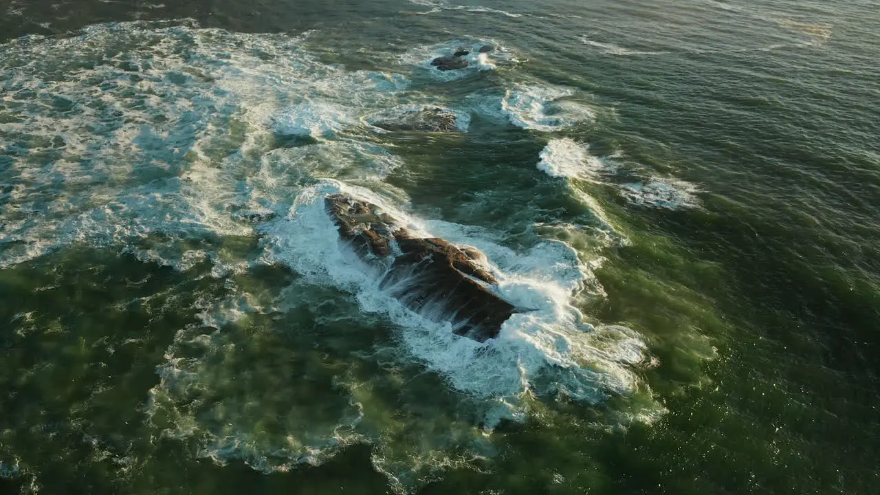 Foamy Sea Waves Crashing On The Rock At Oudekraal Beach In Cape Town South Africa aerial slow motion