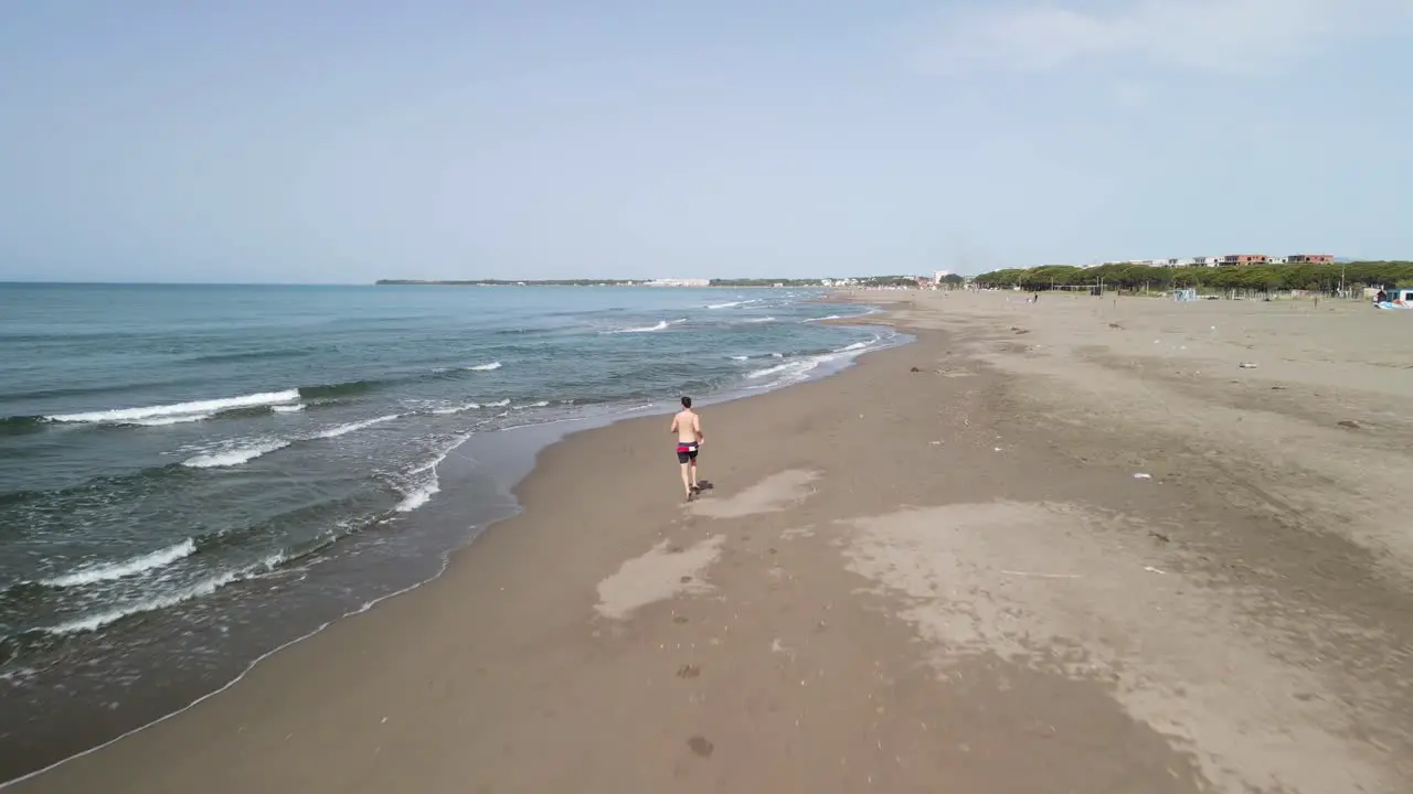 Man sprinting on the beach alone